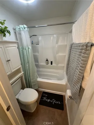 a bed sitting in a room next to a window