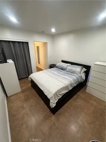 a view of a livingroom with furniture and a flat screen tv