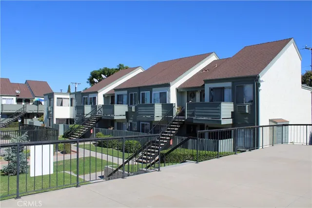 a front view of house with yard outdoor seating and barbeque oven