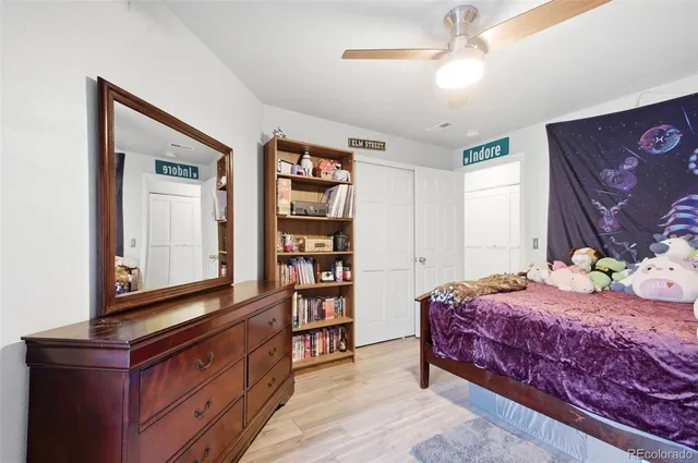 a bedroom with a bed furniture and decor