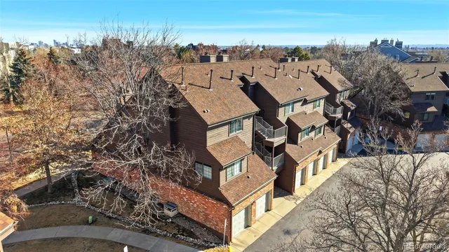 a aerial view of a house with large trees