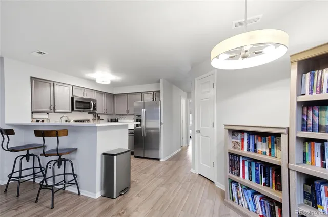 a kitchen with a sink cabinets and appliances