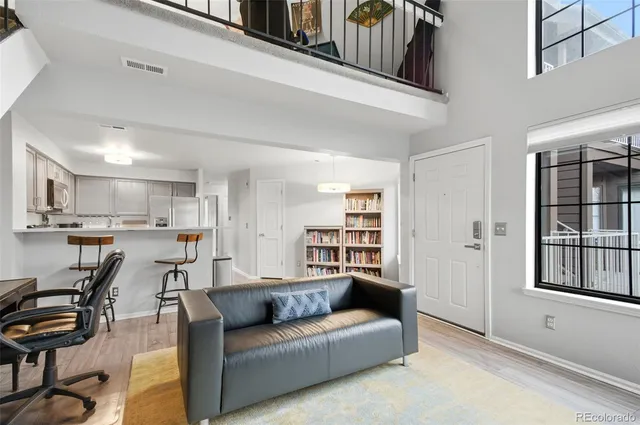 a view of a living room kitchen and a window