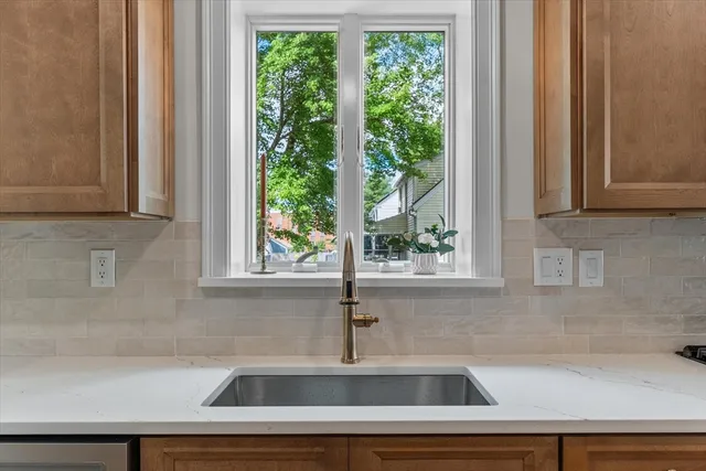 a kitchen with a sink and a window