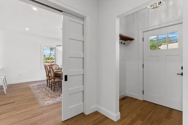 a view of kitchen with furniture and wooden floor