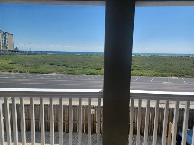 a view of a balcony with an ocean