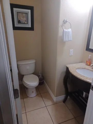 a bathroom with a toilet and a sink