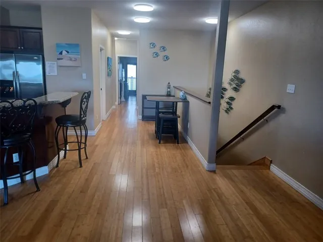 a view of a living room and wooden floor