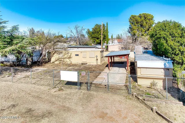 a view of a terrace with a bench and trees
