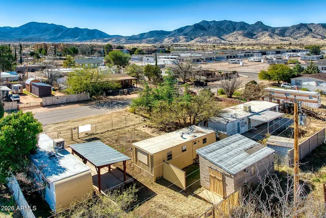 an aerial view of a house with mountain view
