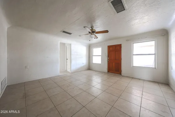 a view of an empty room with a window