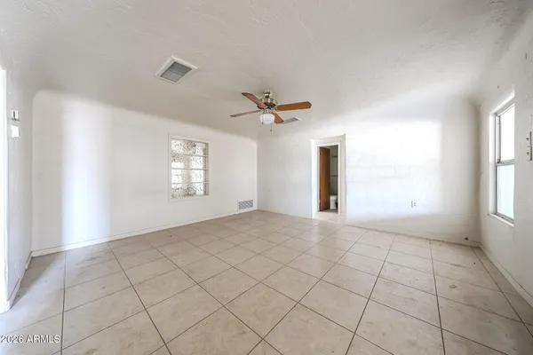 a view of an empty room with a window