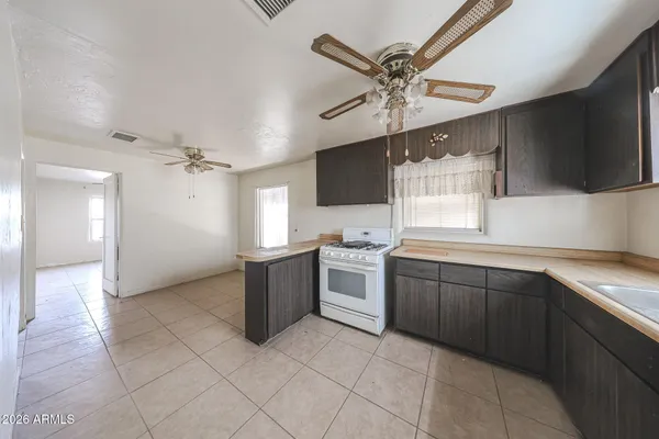 a kitchen with a cabinets and appliances