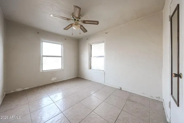 a view of an empty room with a window