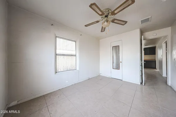 a view of an empty room with a window