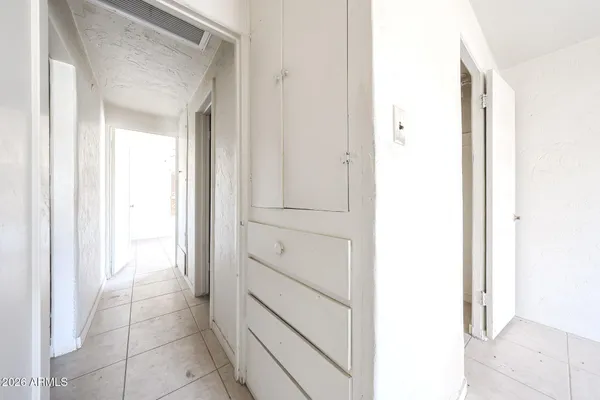 a view of an empty room with a window