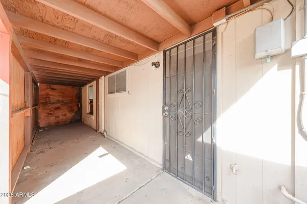 a view of an empty room with a window