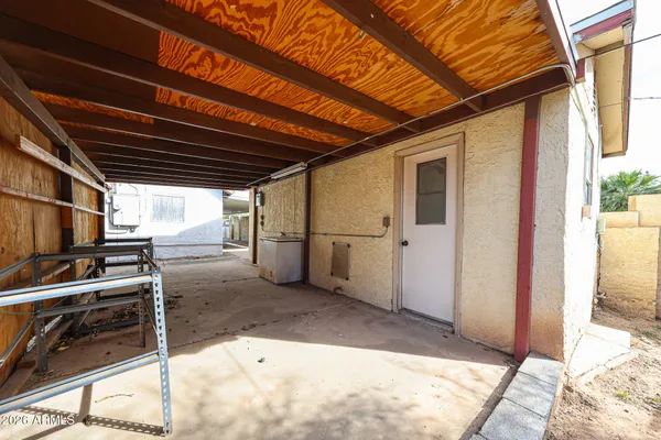 a view of an empty room with a ceiling fan