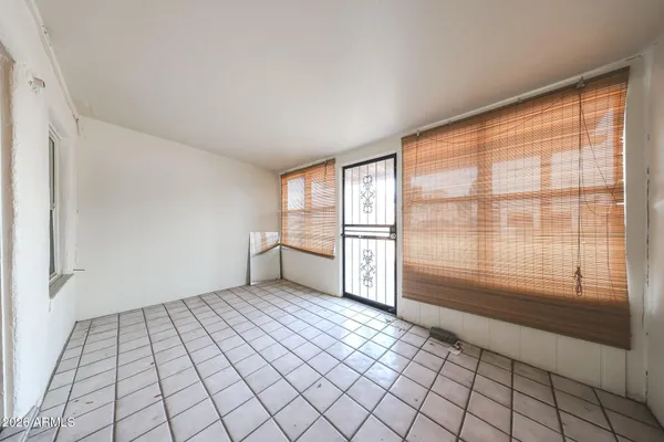 a view of an empty room and window