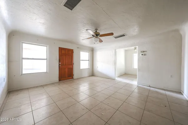 a view of an empty room with a window