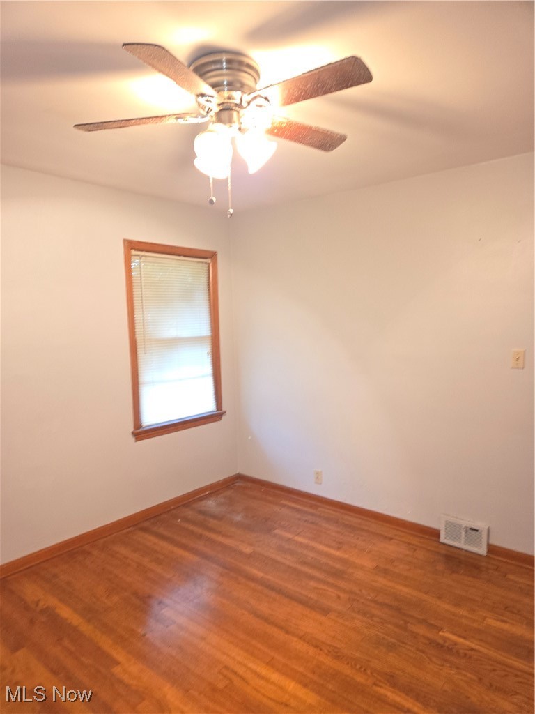 14712 Rockside Road Maple Heights, OH 44137 - Photo 13 of 23 Spare room with wood finished floors and ceiling fan