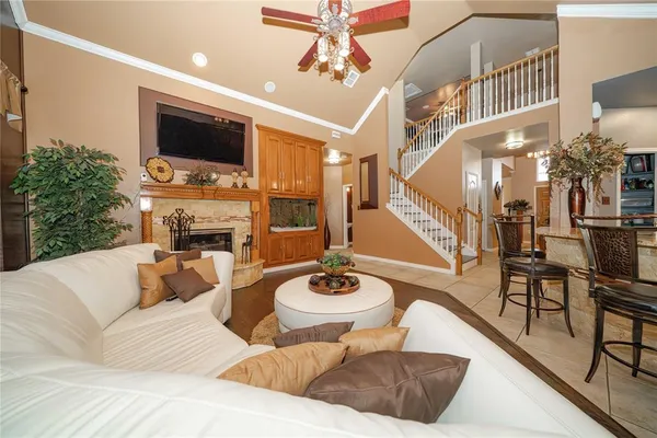 a living room with furniture and a fireplace