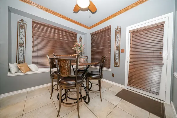 a dining room with furniture and window