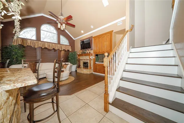 a very nice looking room with a large window and furniture