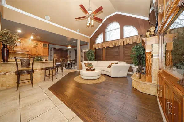 a living room with lots of table and chairs