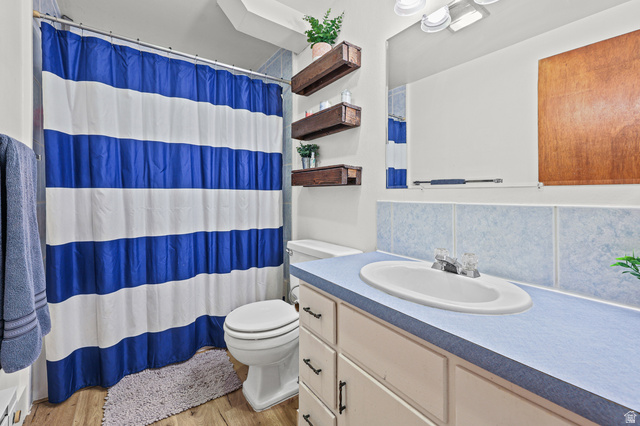 822 Pinewood Circle Price, UT 84501 - Photo 26 of 49 Bathroom featuring a single vanity with an oval sink and a blue countertop