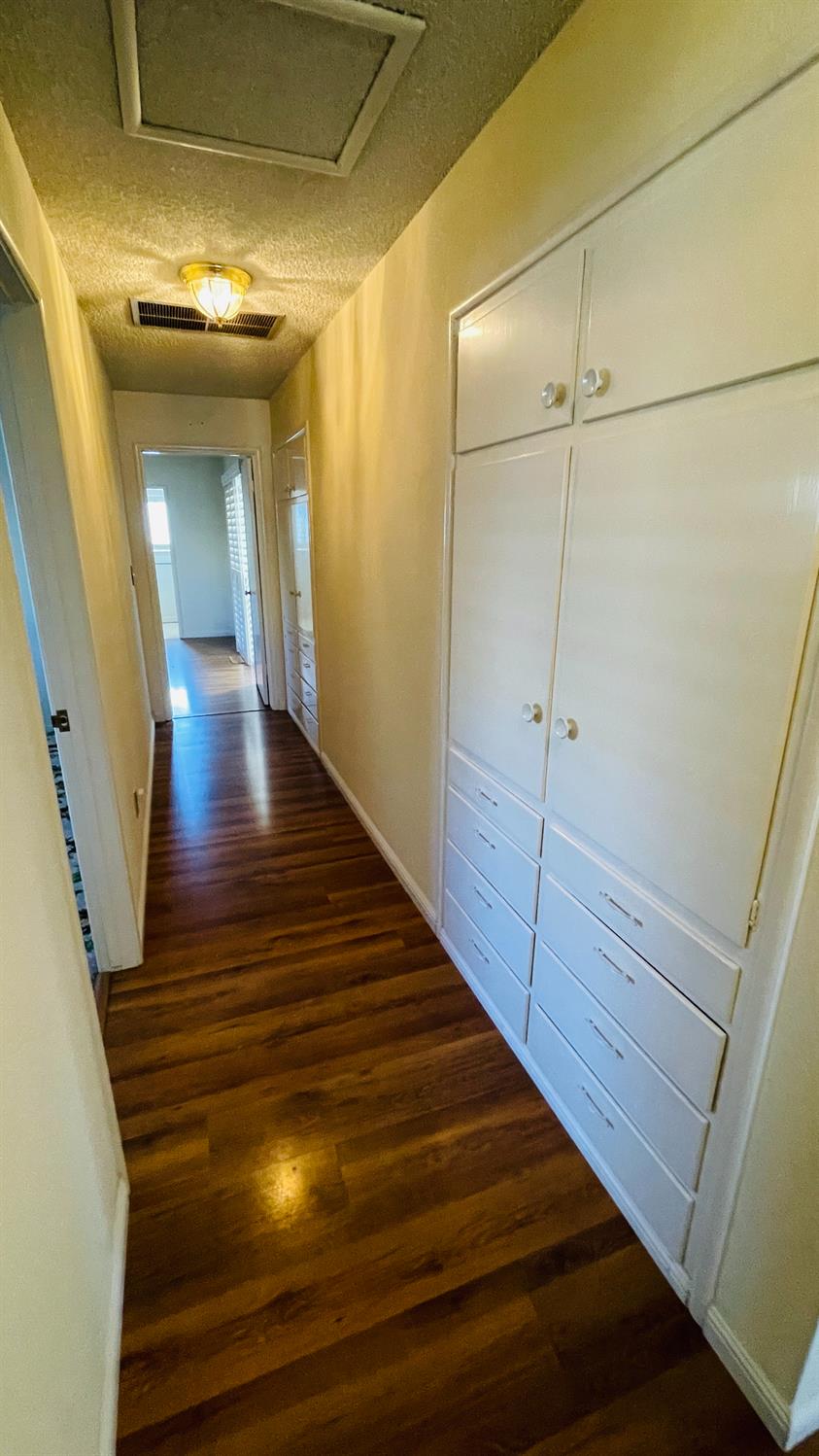 712 Leytonstone Avenue Modesto, CA 95355 - Photo 21 of 32 The hallway continues to add bonuses with three more built-in storage areas.