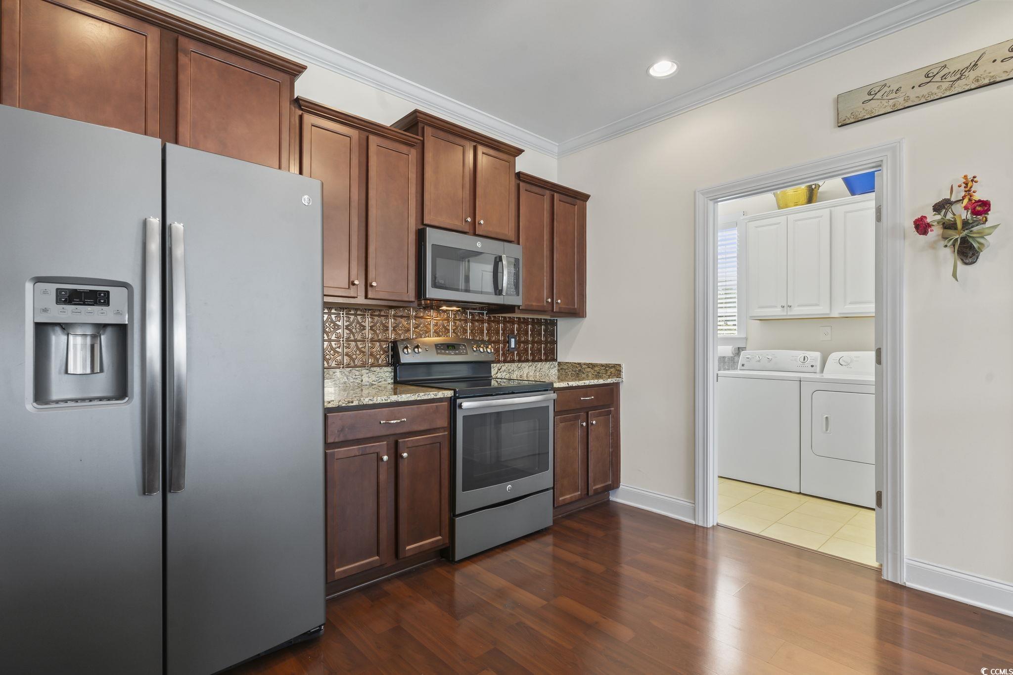 120 Stonehinge Court Conway, SC 29526 - Photo 12 of 31 Kitchen featuring washer and clothes dryer, crown