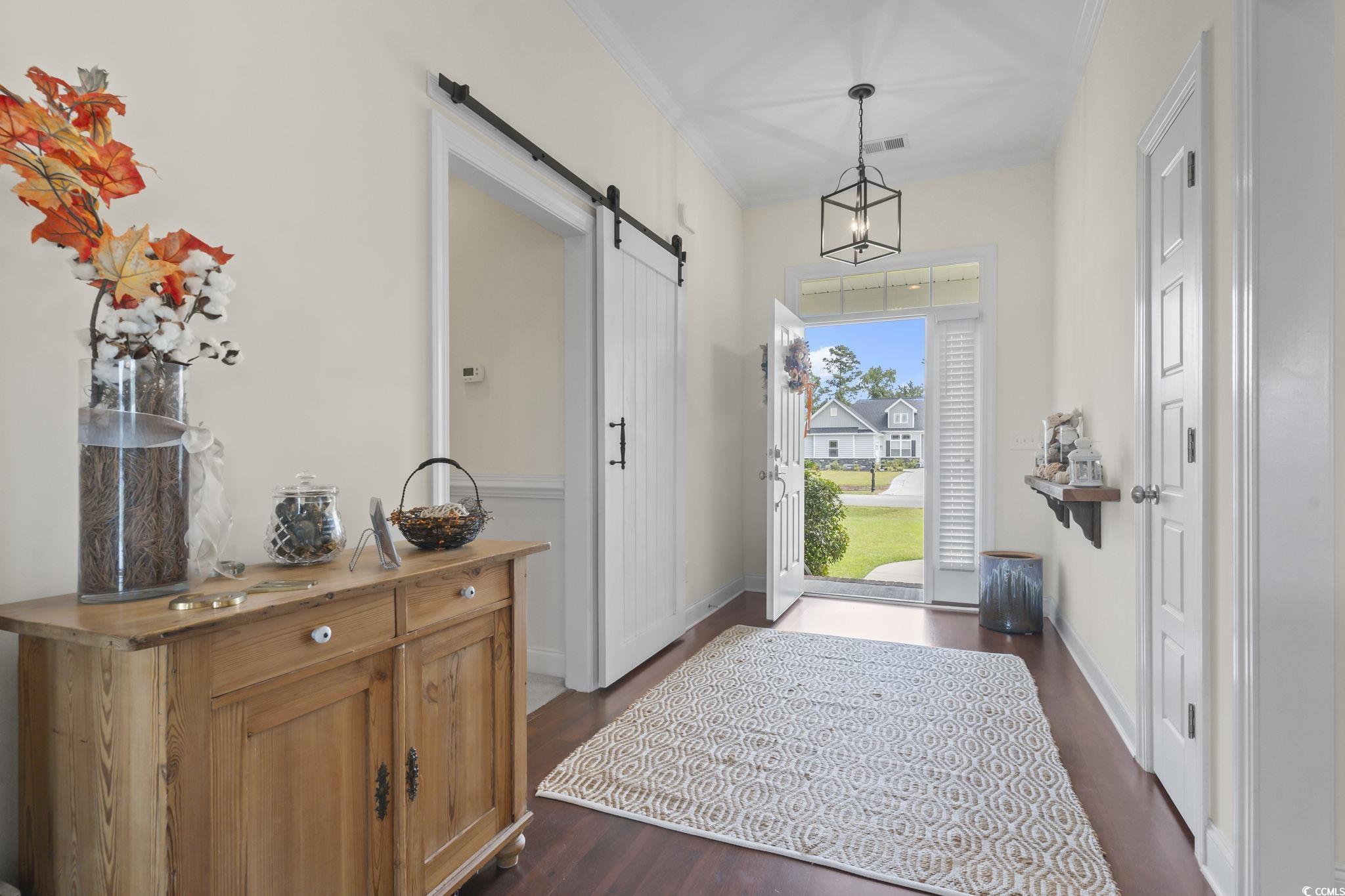 120 Stonehinge Court Conway, SC 29526 - Photo 8 of 31 Entryway featuring crown molding, dark wood-type f