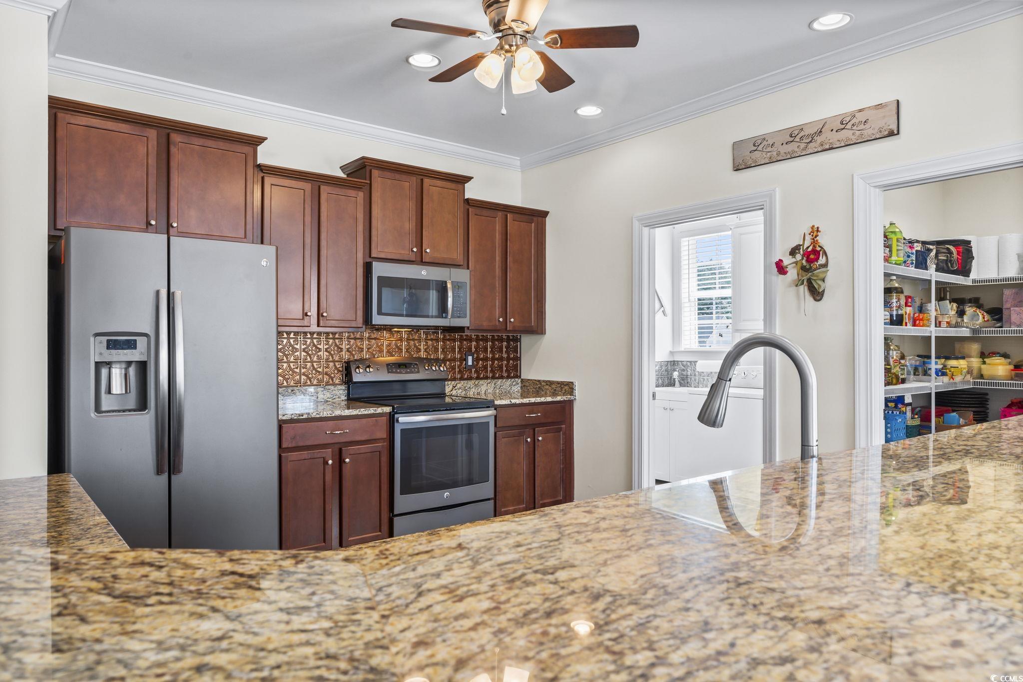 120 Stonehinge Court Conway, SC 29526 - Photo 9 of 31 Kitchen featuring crown molding, stainless steel a