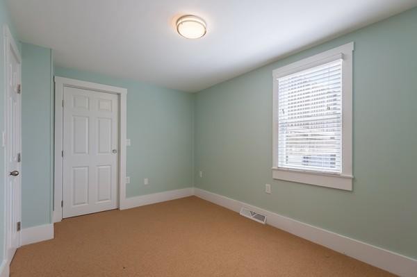 149 Jericho Road, Unit A Scituate, MA 02066 - Photo 17 of 21 an empty room with a window