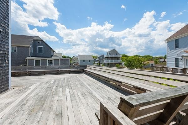149 Jericho Road, Unit A Scituate, MA 02066 - Photo 5 of 21 a view of a balcony with two chairs and a barbeque