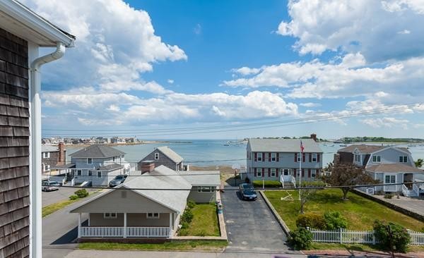 149 Jericho Road, Unit A Scituate, MA 02066 - Photo 8 of 21 a view of a lake with a barbeque grill and a city view