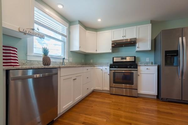 149 Jericho Road, Unit A Scituate, MA 02066 - Photo 9 of 21 a kitchen with a refrigerator stove and sink