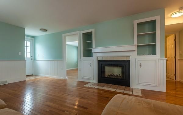 149 Jericho Road, Unit A Scituate, MA 02066 - Photo 10 of 21 a view of an empty room with wooden floor and a window
