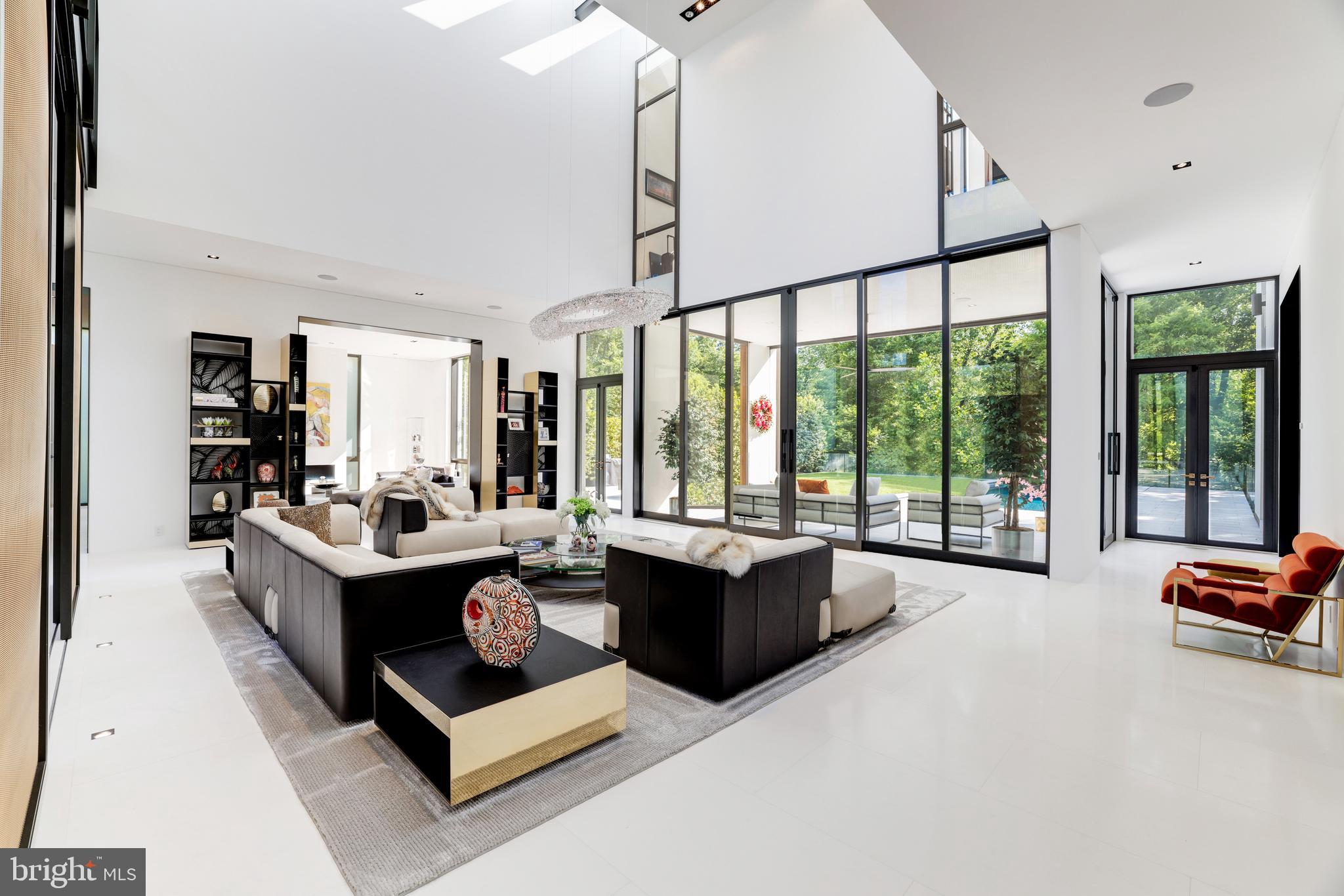 410 Chain Bridge Road McLean, VA 22101 - Photo 12 of 26 a living room with furniture large window and a table