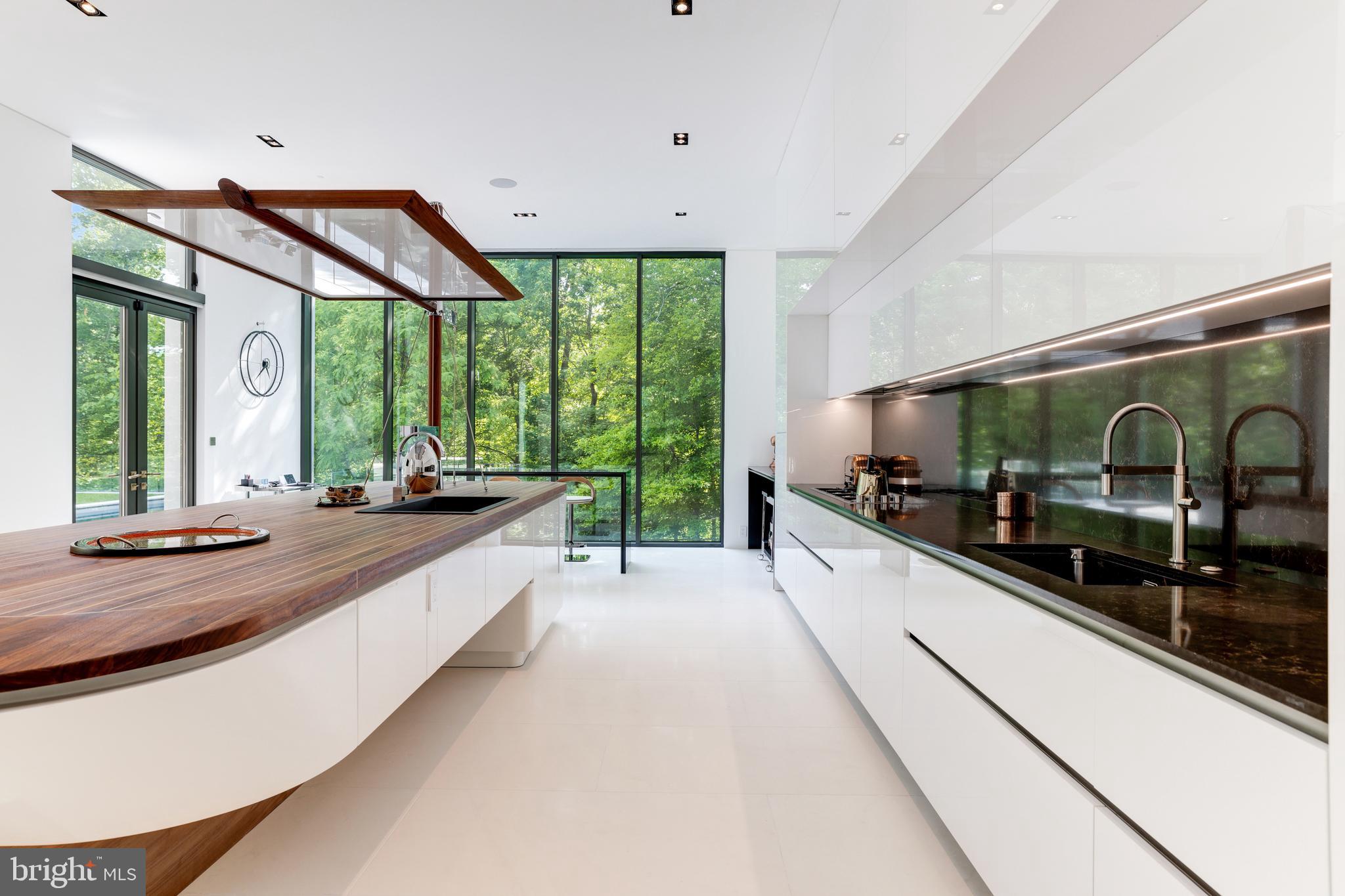 410 Chain Bridge Road McLean, VA 22101 - Photo 14 of 26 a large white kitchen with a large window
