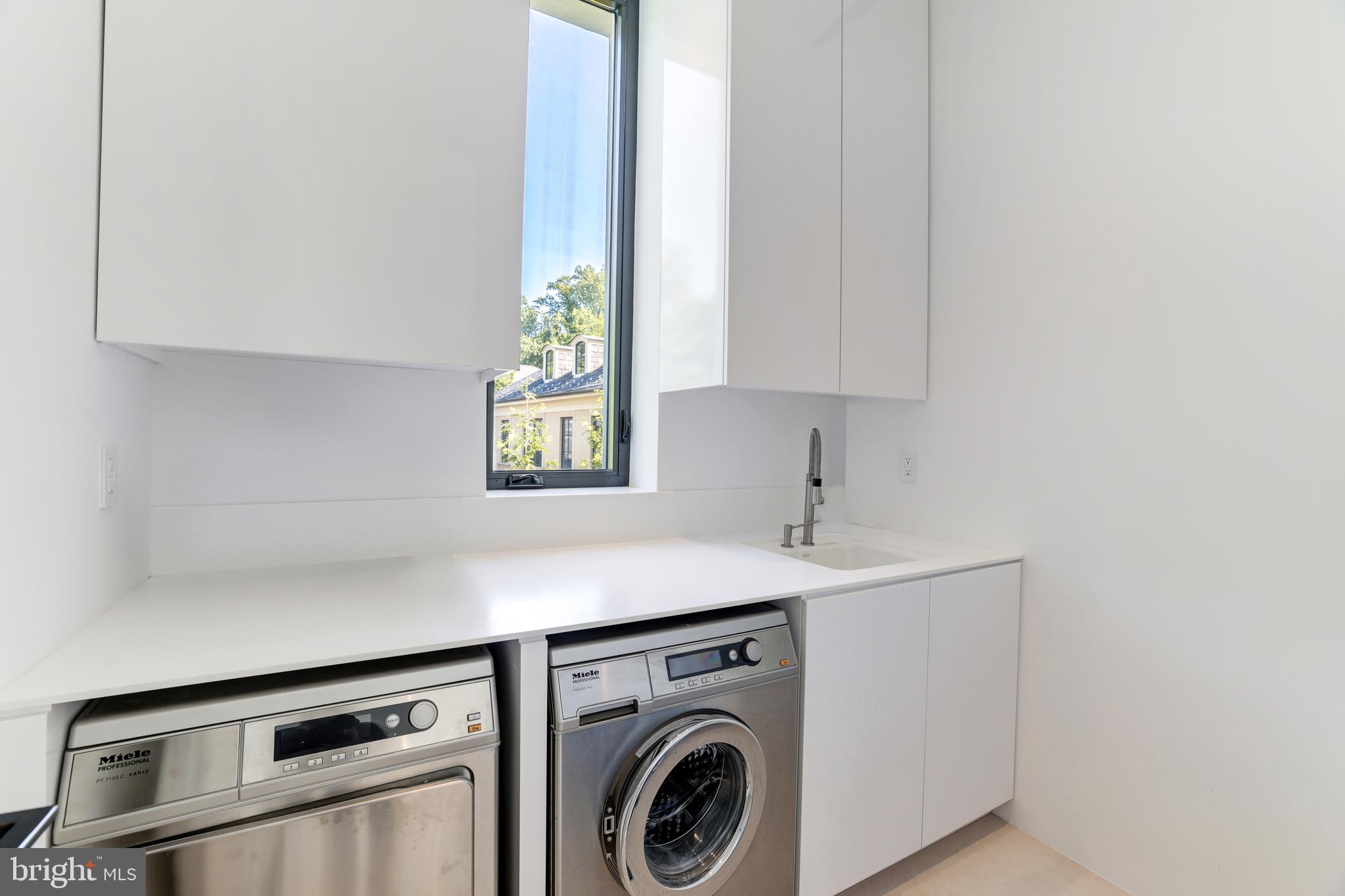 410 Chain Bridge Road McLean, VA 22101 - Photo 17 of 26 a utility room with dryer and washer
