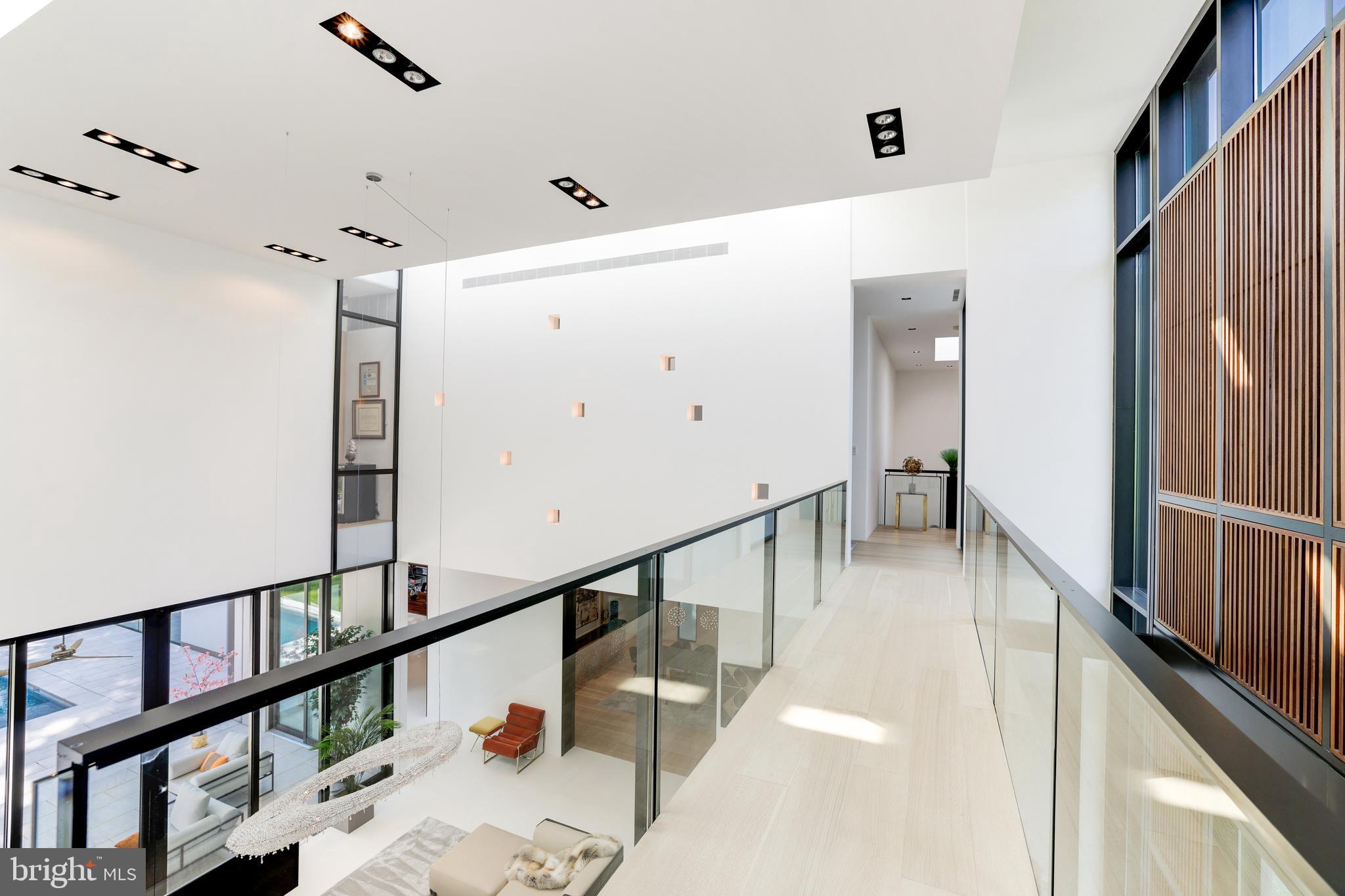 410 Chain Bridge Road McLean, VA 22101 - Photo 20 of 26 a view of a hallway with wooden floor and staircase