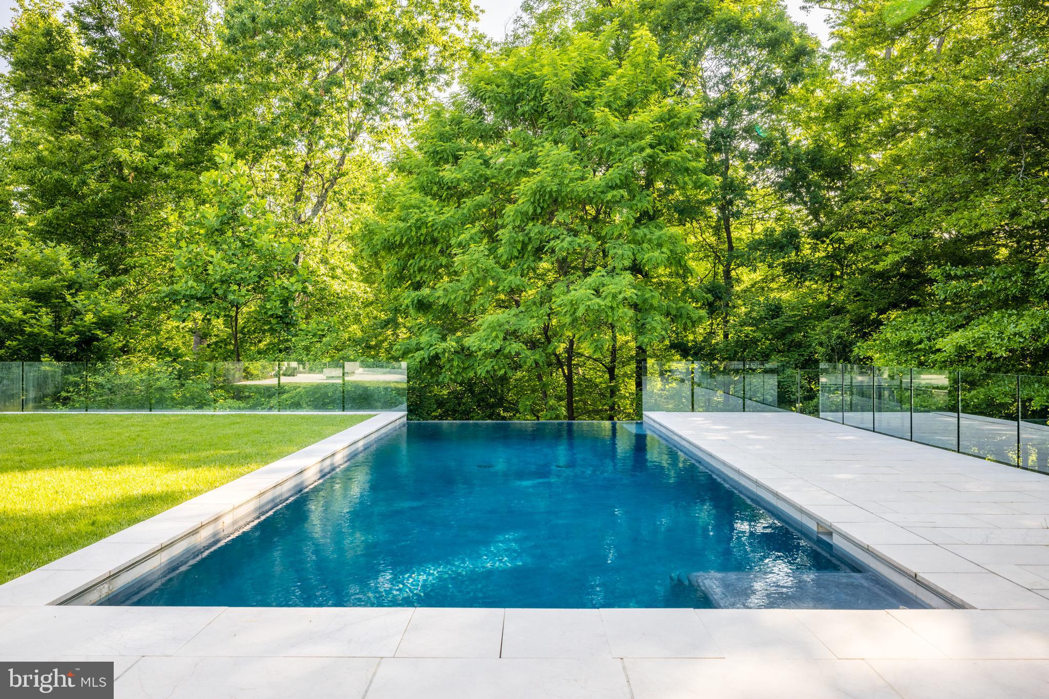 410 Chain Bridge Road McLean, VA 22101 - Photo 23 of 26 a picture of a field with trees in the background
