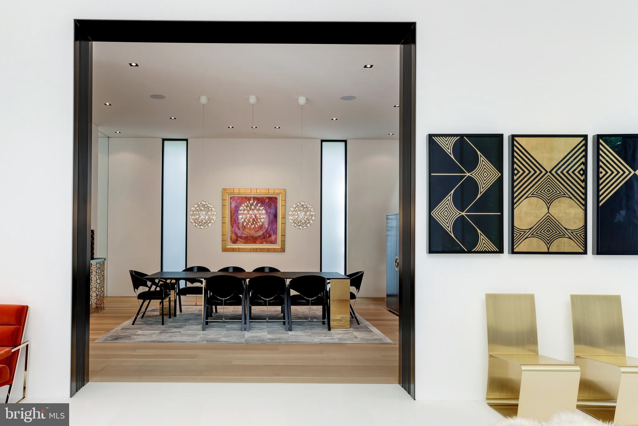 410 Chain Bridge Road McLean, VA 22101 - Photo 9 of 26 a view of a hallway with dining room and furniture