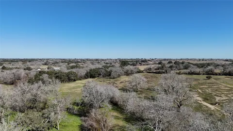 an aerial view of a house with a garden