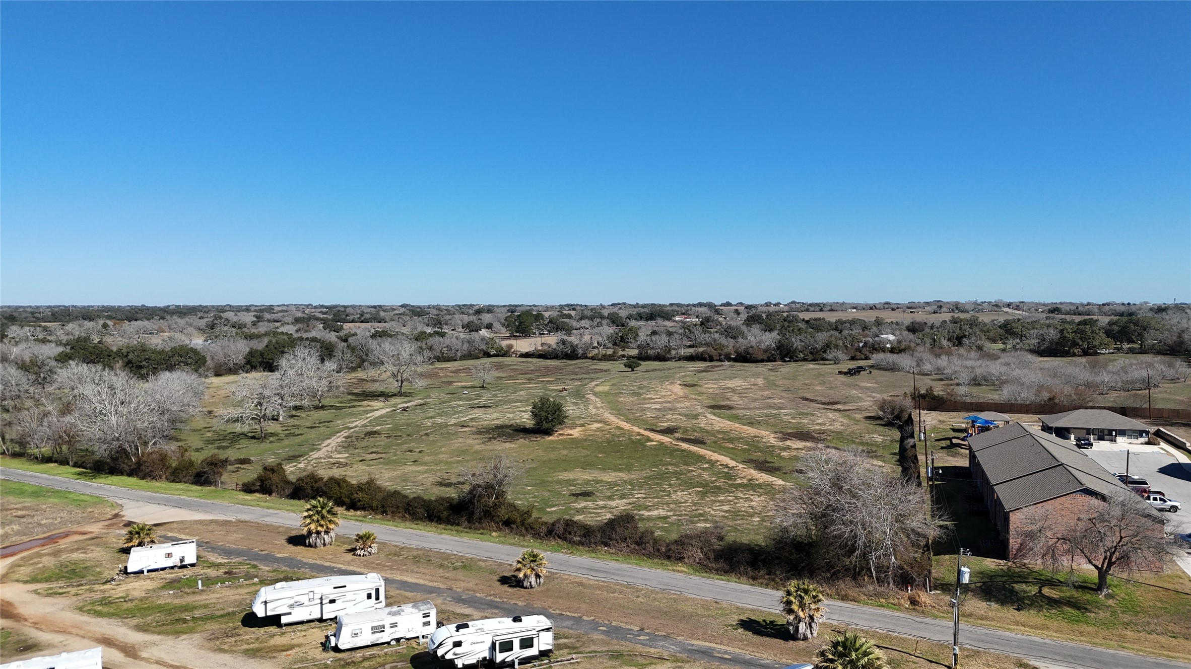 305 Ellen May Road Yoakum, TX 77995 - Photo 29 of 30 an aerial view of residential houses with outdoor space