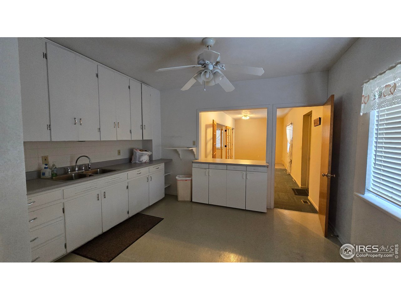118 Dickson Street Wiggins, CO 80654 - Photo 18 of 34 KITCHEN FACING THE ROOM BEHIND THE MAIN AUDITORIUM