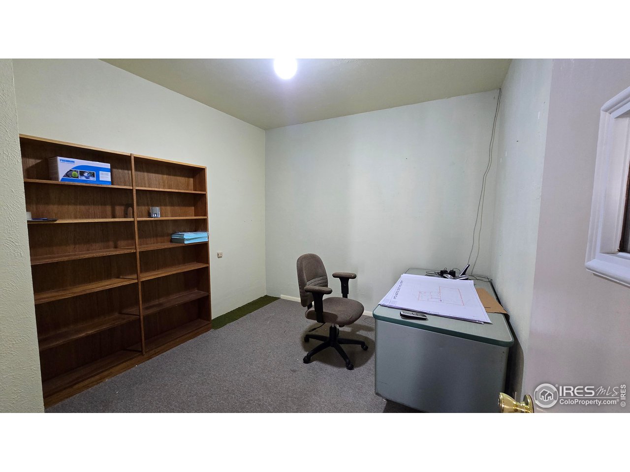 118 Dickson Street Wiggins, CO 80654 - Photo 23 of 34 MIDDLE OFFICE AT THE ENTRYWAY