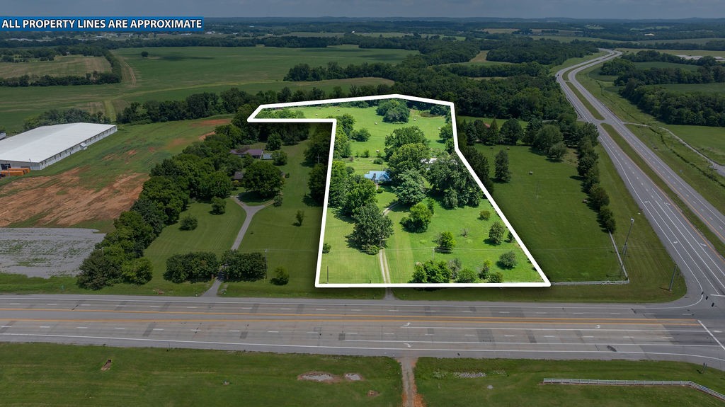an aerial view of a yard with a lake view